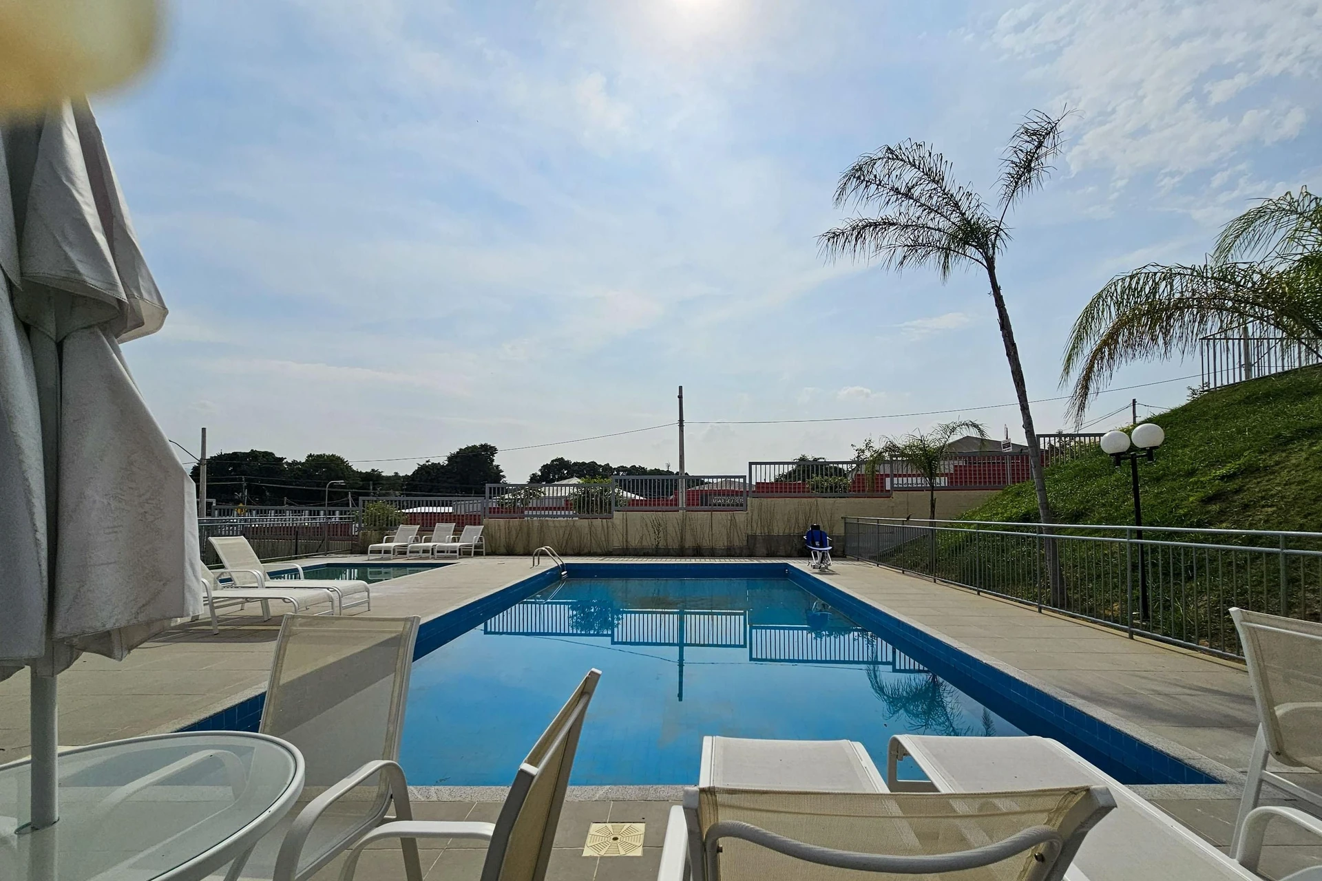 2-bedroom apartment in a building with a pool — photo 17