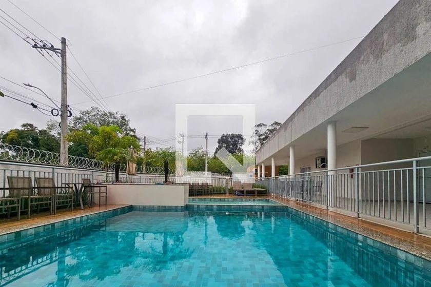 2-bedroom apartment in a building with a pool — photo 16