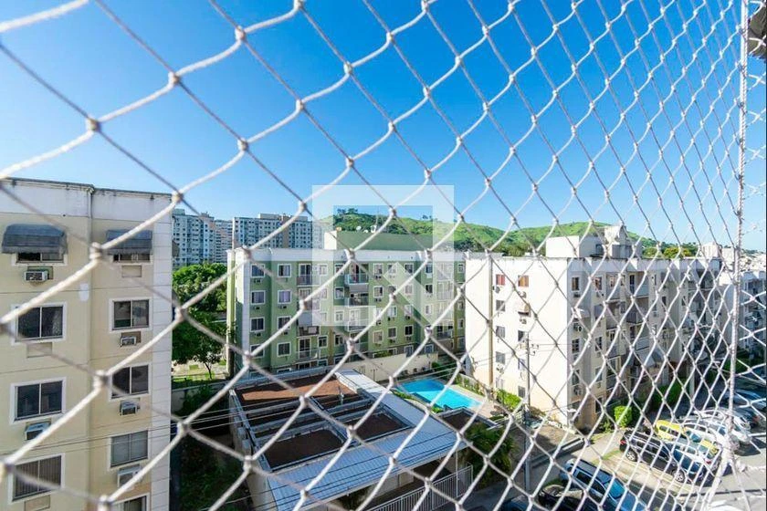 2-bedroom apartment in a building with a pool — photo 13