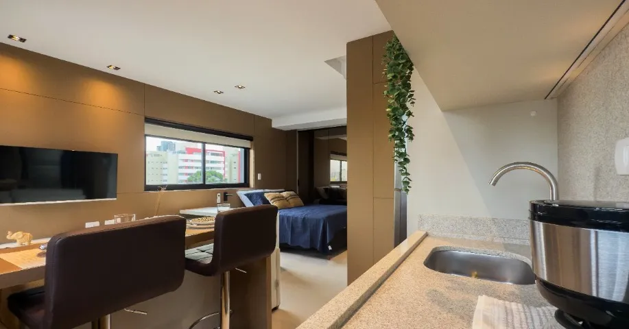 Furnished studio with open-plan kitchen and balcony — photo 2