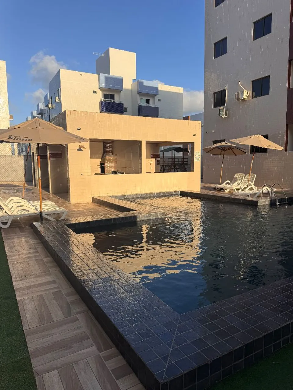 2-bedroom apartment in a building with a pool — photo 11