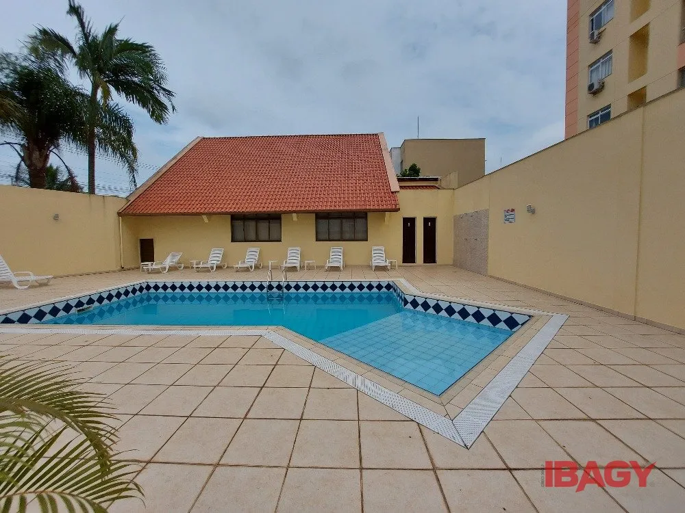 2-bedroom apartment in a building with a pool — photo 7