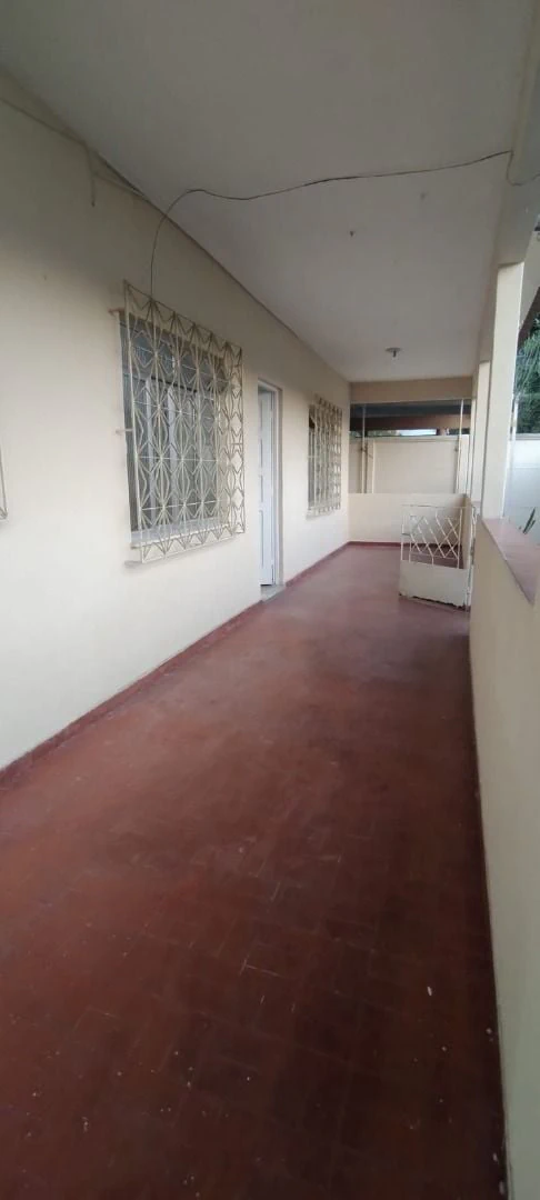 1-bedroom house with a balcony and yard