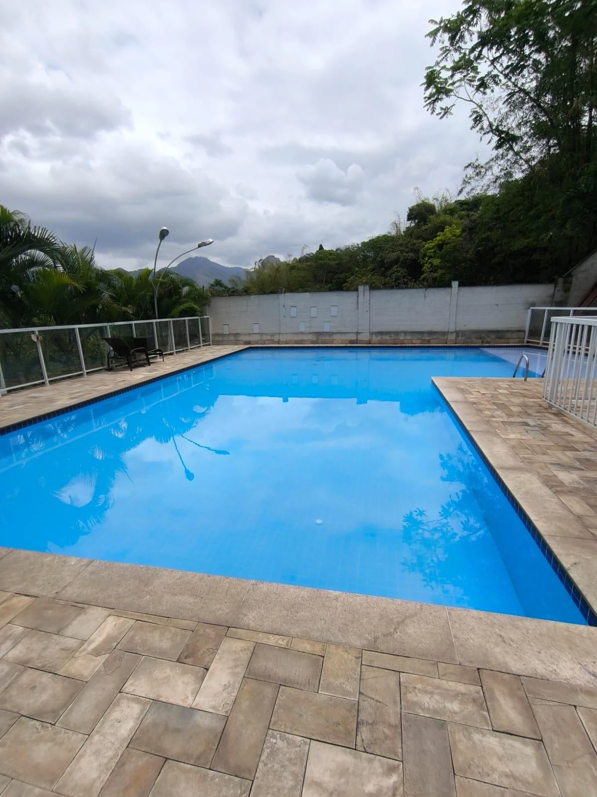2-bedroom apartment in a building with a pool — photo 34