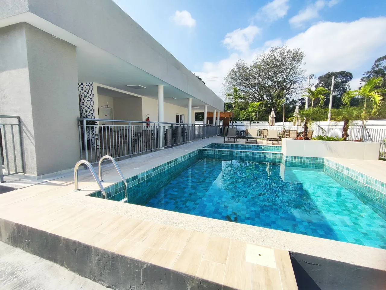 2-bedroom apartment in a building with a pool — photo 14