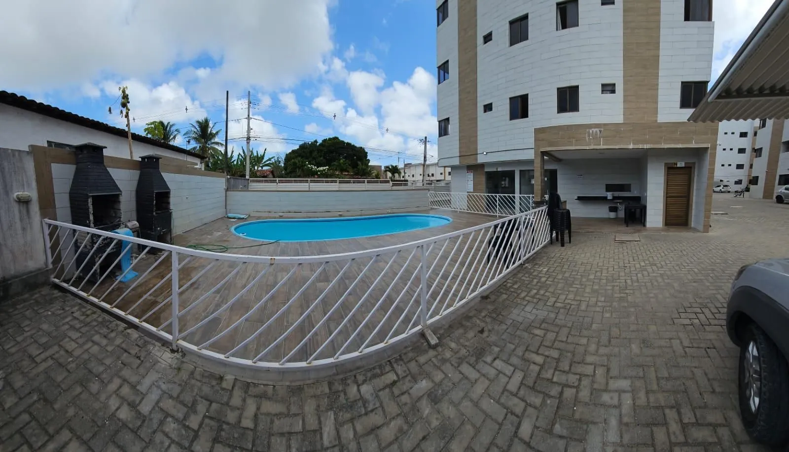 2-bedroom apartment in a building with a pool — photo 12