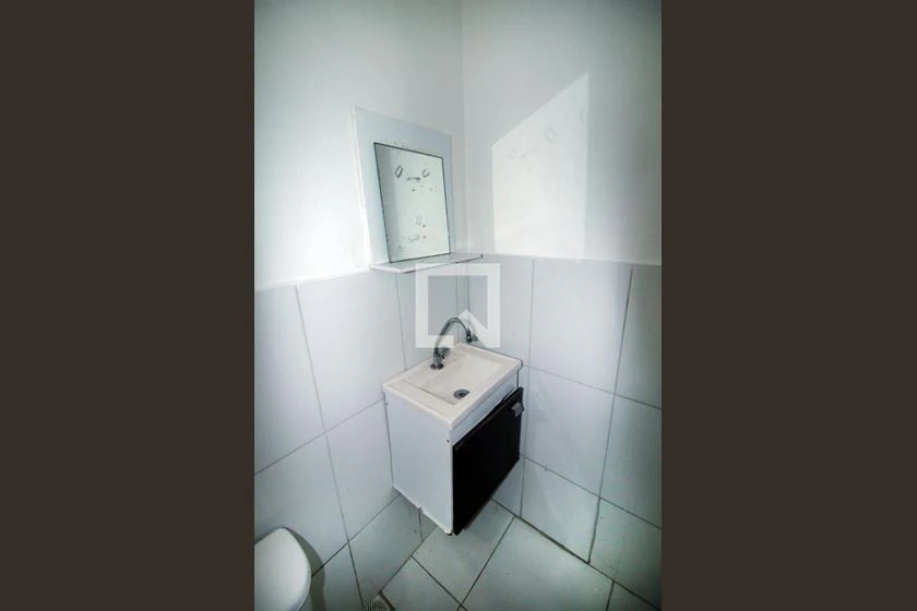 Unfurnished studio with gas stove and laundry area — photo 2