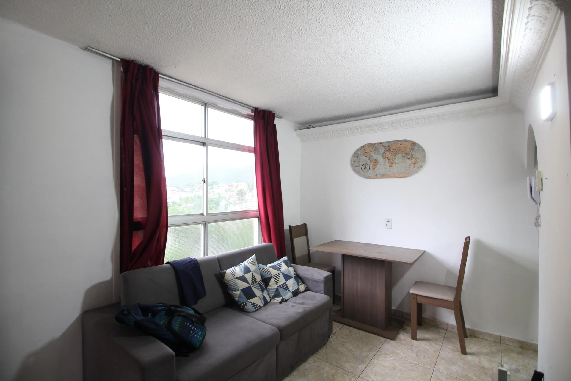 1-bedroom apartment with a closed kitchen and laundry area