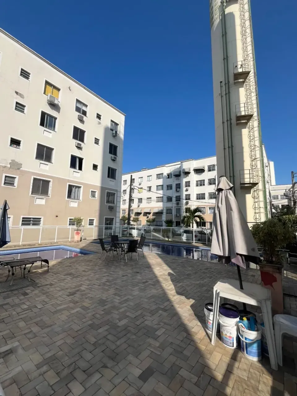 2-bedroom apartment in a building with a pool — photo 18