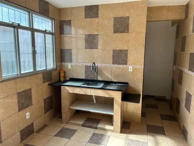 Casa sem mobília com cozinha fechada e terraço — photo 10