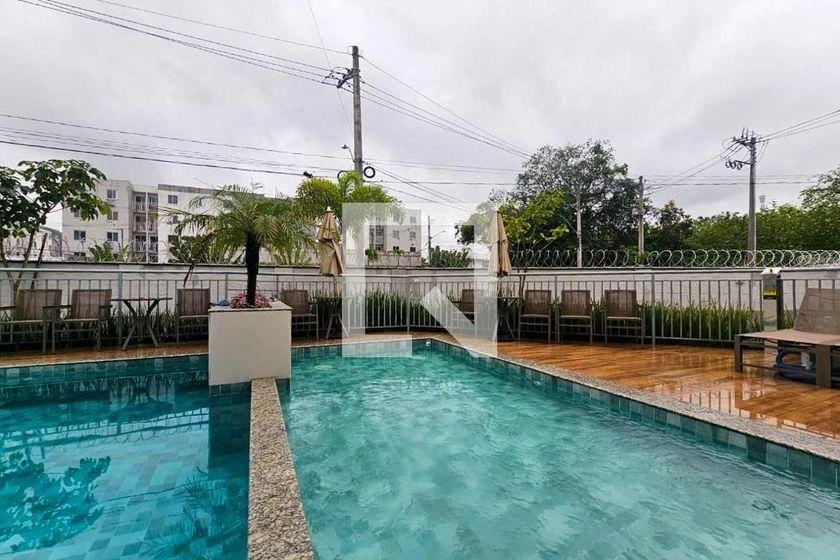 2-bedroom apartment in a building with a pool — photo 34