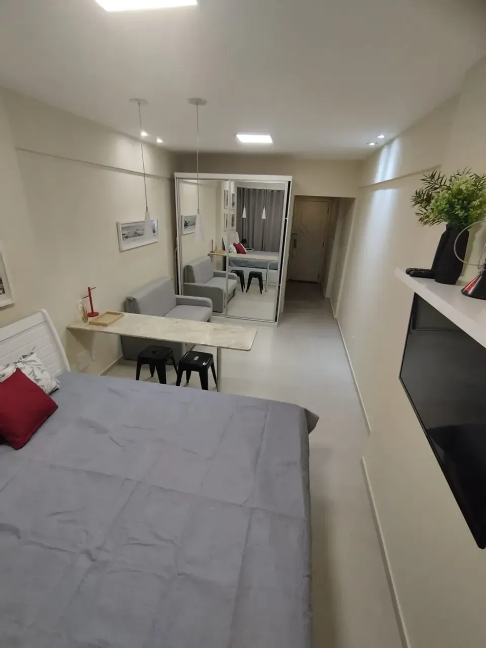 Furnished apartment with a compact cooking setup — photo 9