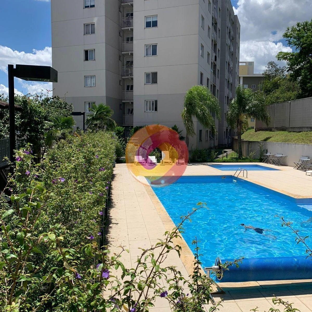 3-bedroom apartment in a building with a pool