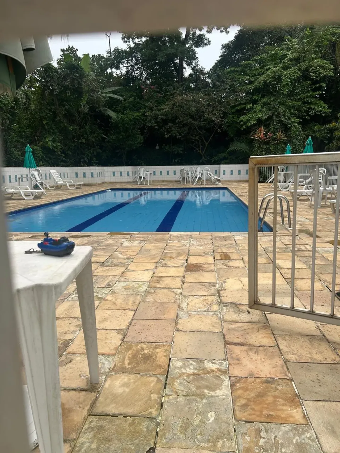One-bedroom apartment in a building with a pool — photo 8