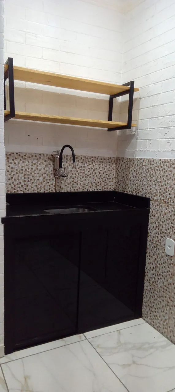 Apartamento com cozinha integrada e sala em plano aberto — photo 12