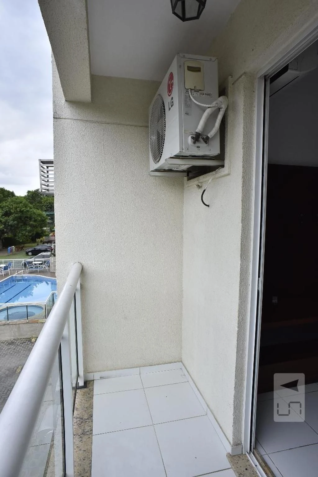 2-bedroom apartment in a building with a pool — photo 13