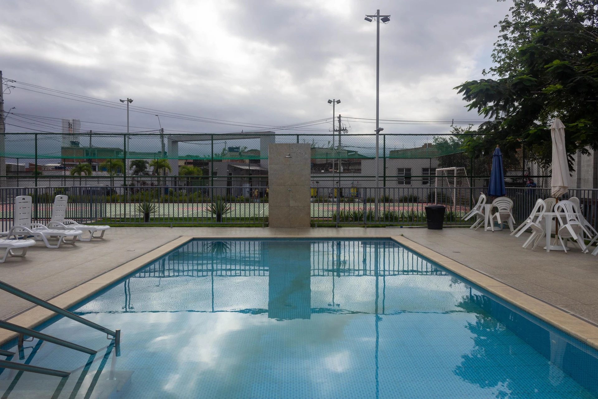 2-bedroom apartment in a building with a pool — photo 36