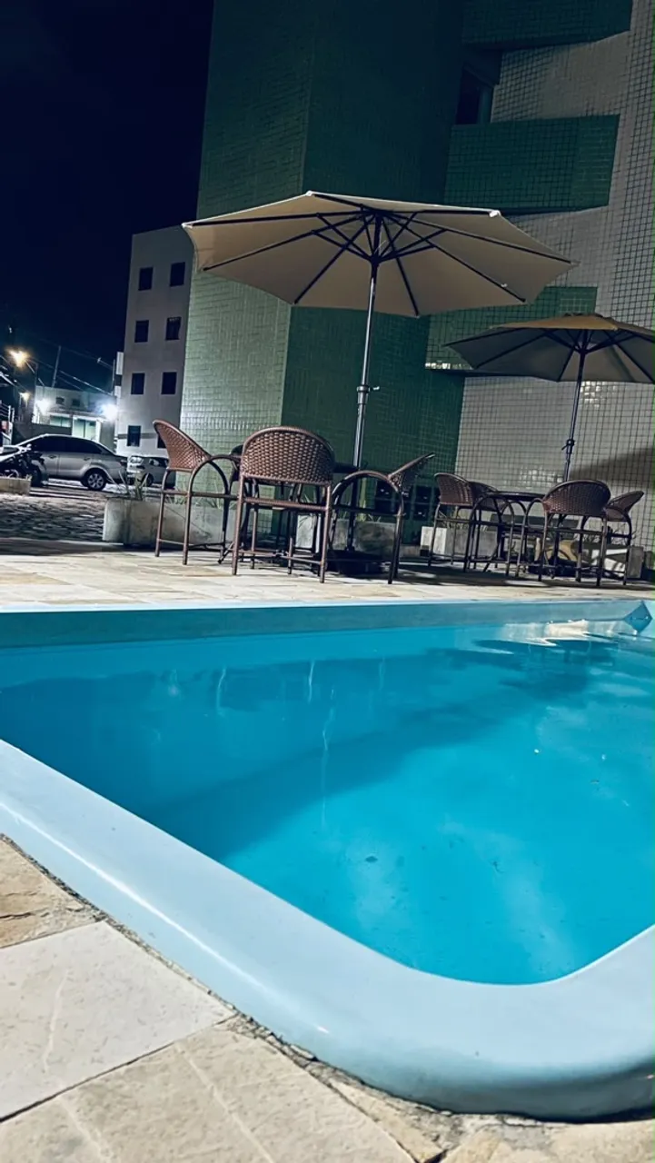 2-bedroom apartment in a building with a pool — photo 7
