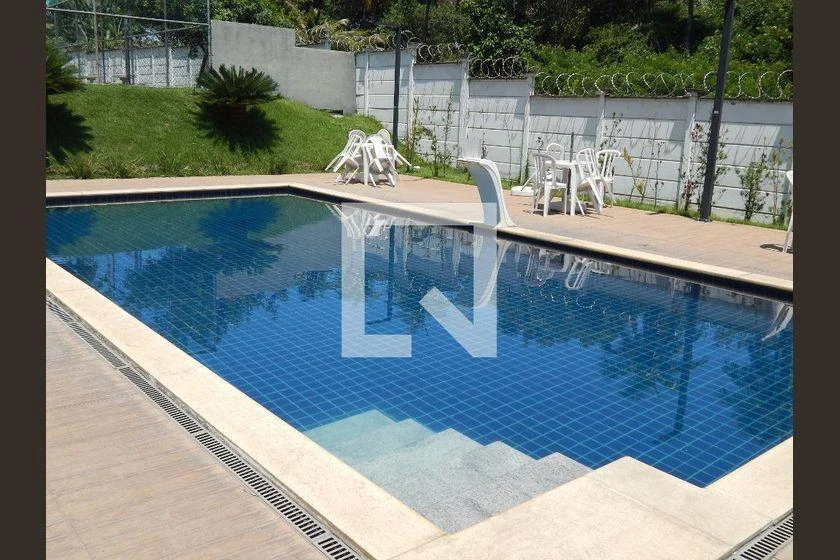 2-bedroom apartment in a building with a pool — photo 16