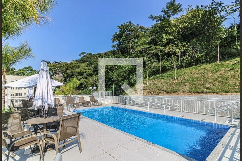 2-bedroom apartment in a building with a pool — photo 26