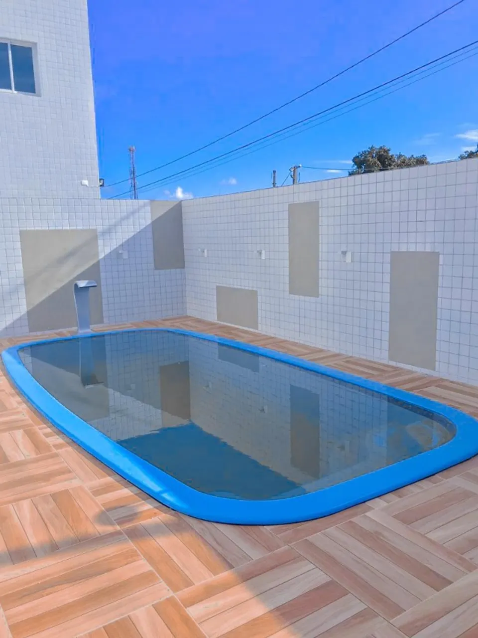 2-bedroom apartment in a building with a pool