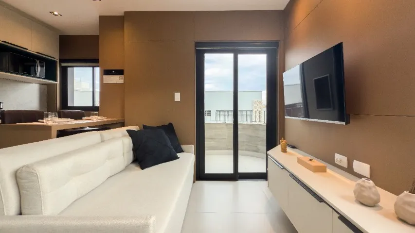 Furnished studio with open-plan kitchen and balcony — photo 16