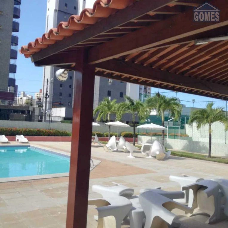 3-bedroom apartment in a building with a pool