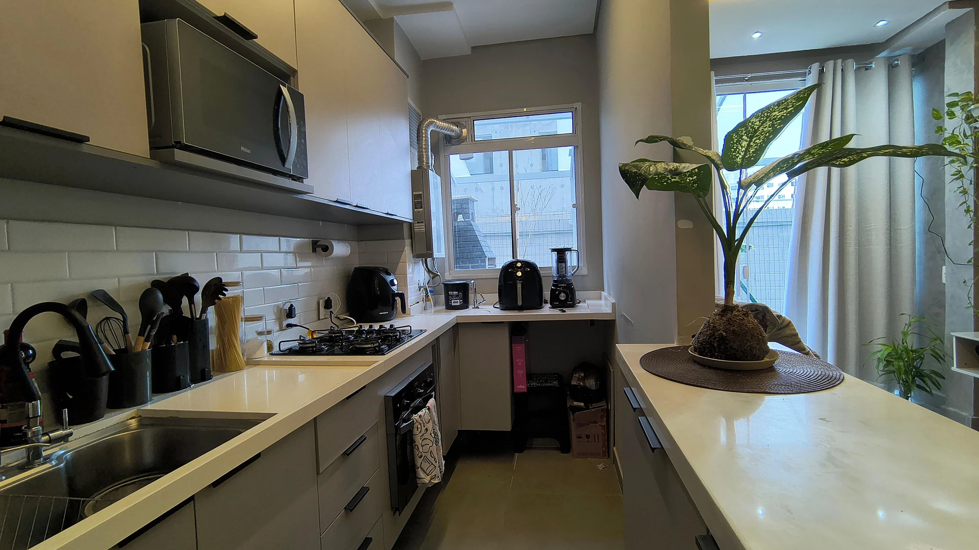 Furnished apartment with open-plan kitchen and balcony — photo 14
