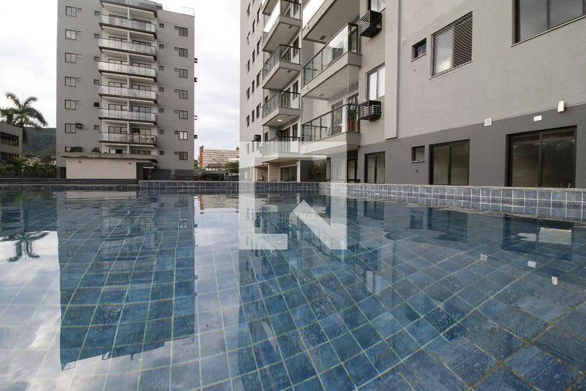 2-bedroom apartment in a building with a pool — photo 43