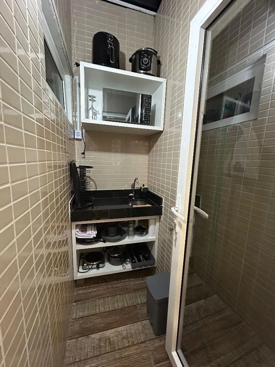1-bedroom, 1-bath apartment with a compact kitchenette — photo 2