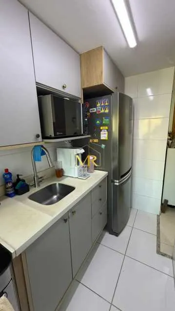 2-bedroom apartment in a building with a pool — photo 10
