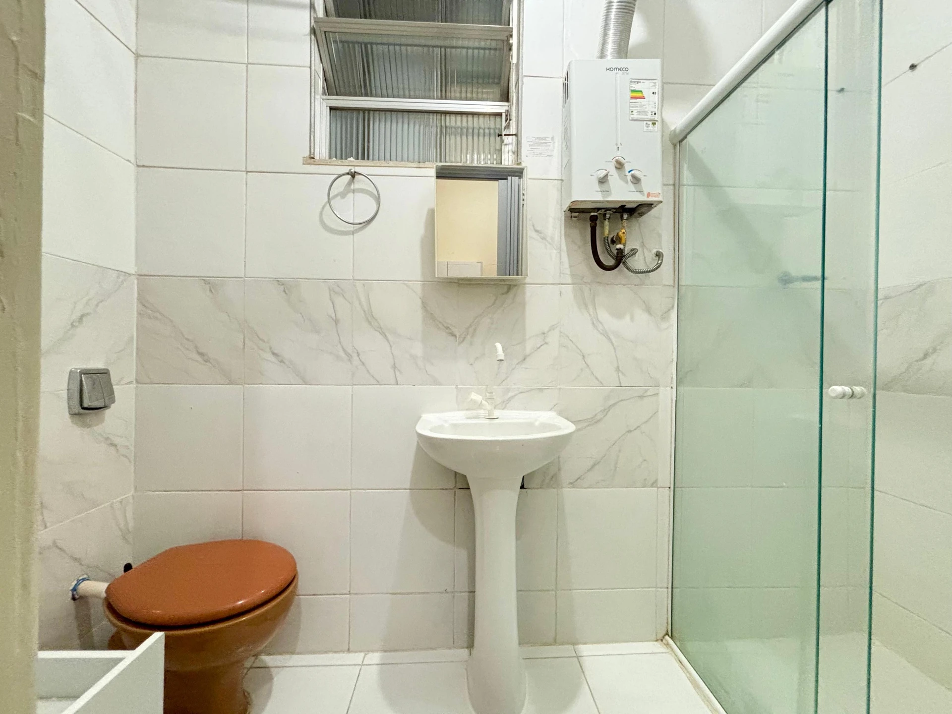 Furnished studio with 1 bedroom and a glass shower — photo 8