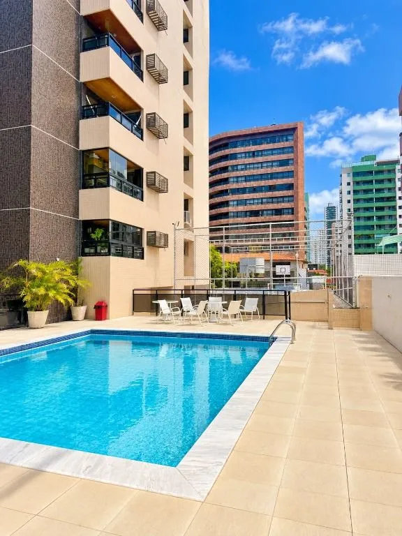 4-bedroom apartment in a building with a pool — photo 5
