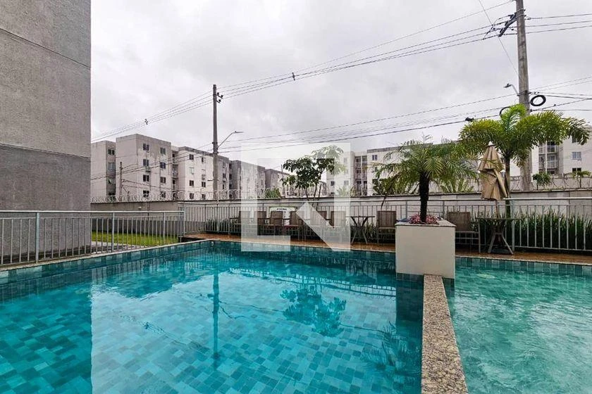 2-bedroom apartment in a building with a pool — photo 19