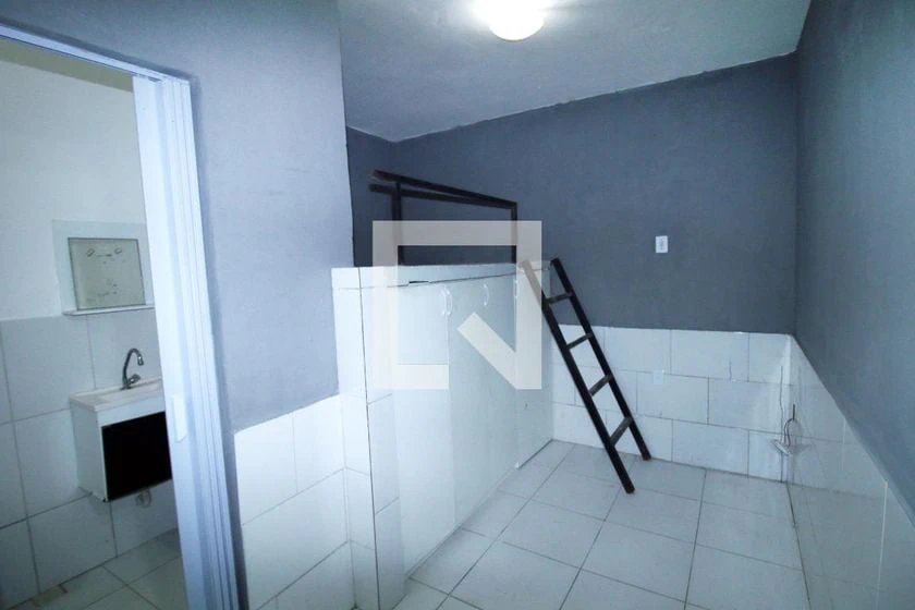 Unfurnished studio with gas stove and laundry area — photo 3
