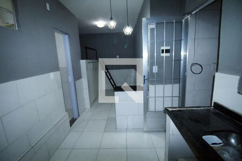 Unfurnished studio with gas stove and laundry area — photo 12