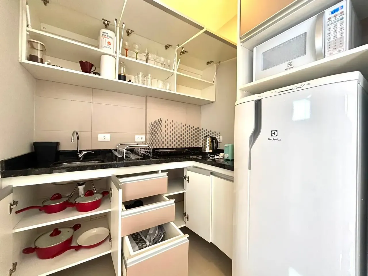 Furnished studio with separate kitchen and desk corner — photo 7