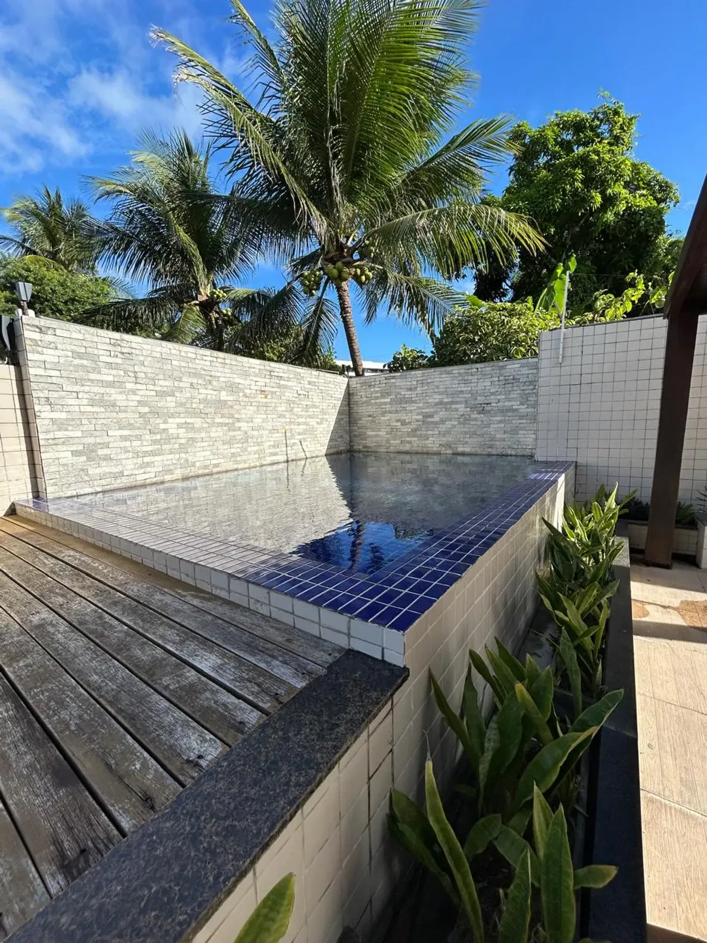 1-bedroom apartment with balcony and shared pool area — photo 5