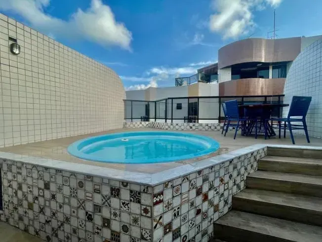 2-bedroom apartment in a building with a pool — photo 19