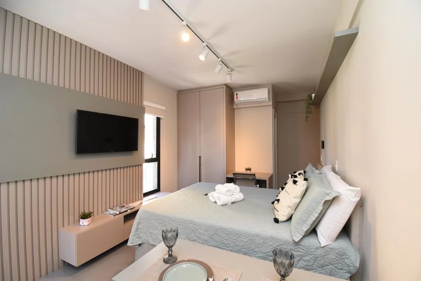 Furnished studio with a balcony and compact kitchenette