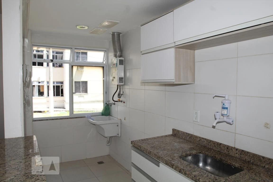 2-bedroom apartment in a building with a pool — photo 2