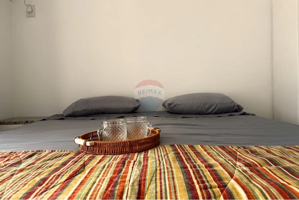 Furnished 1-bedroom apartment with balcony and water view — photo 6