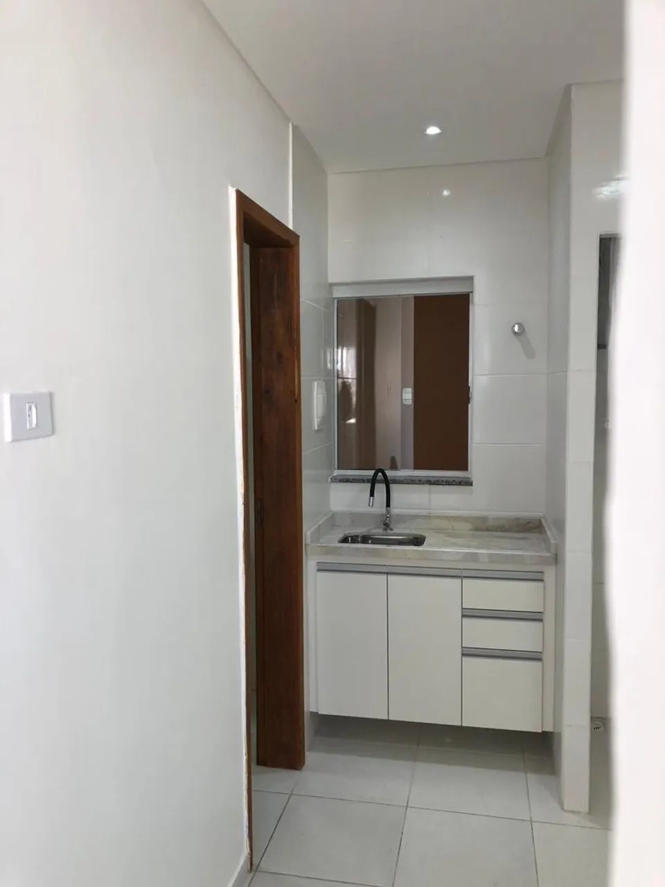 1-bedroom apartment with compact kitchenette and 1 bathroom