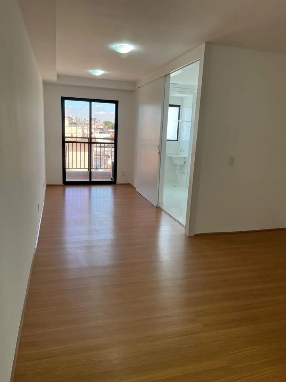 1-bedroom apartment with balcony and laundry area