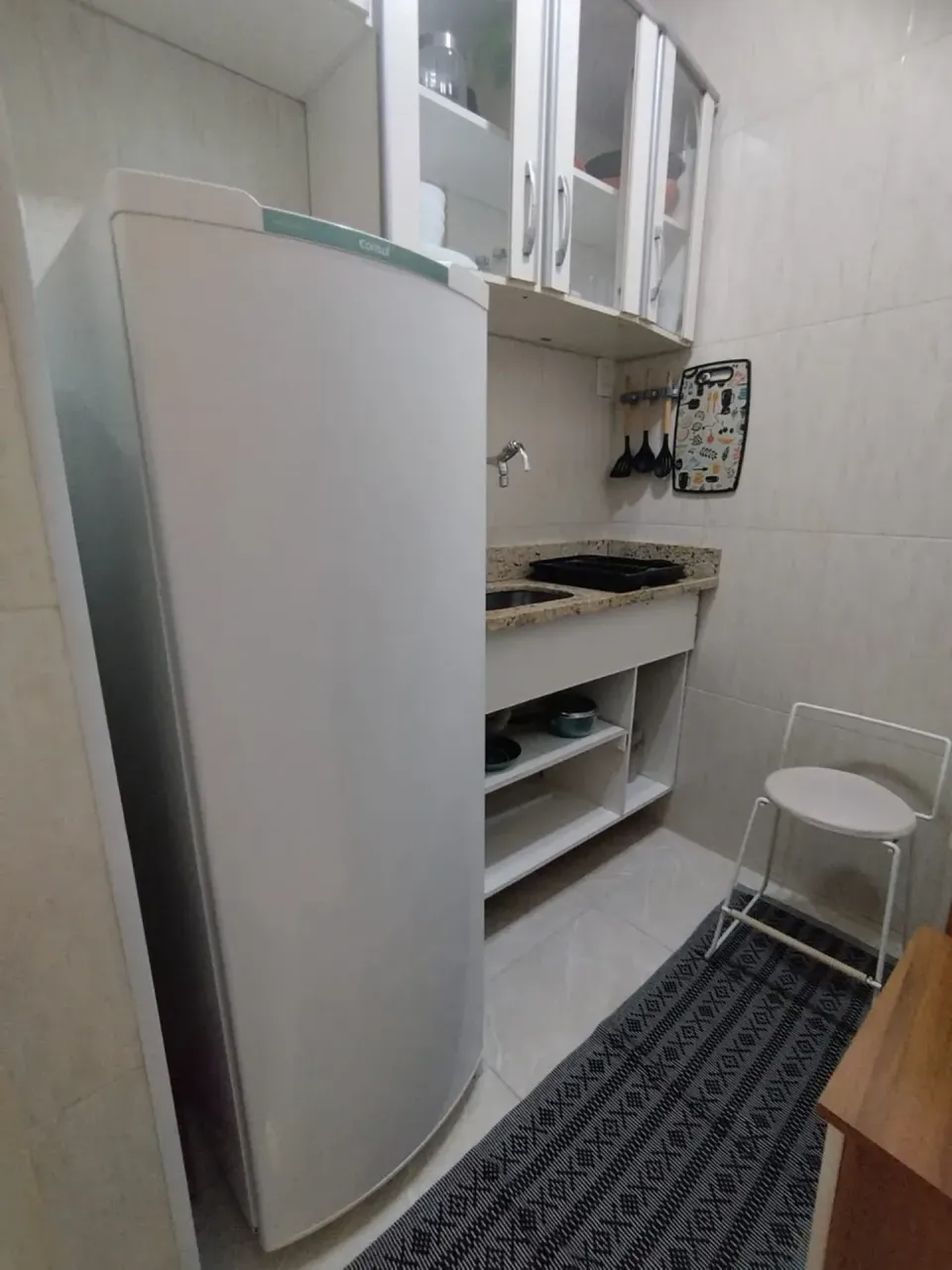 Furnished apartment with a compact cooking setup — photo 10