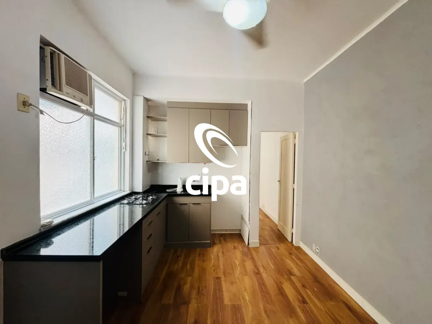 One-bedroom apartment with wood or laminate floors — photo 9