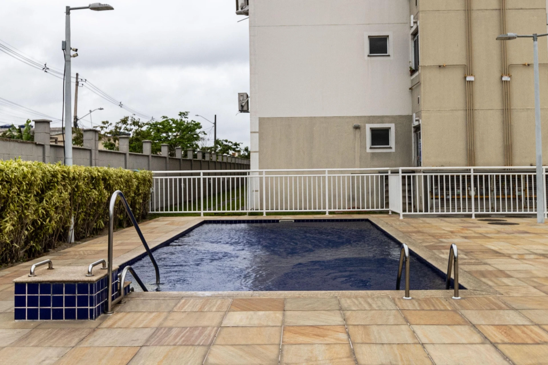 2-bedroom apartment in a building with a pool — photo 11