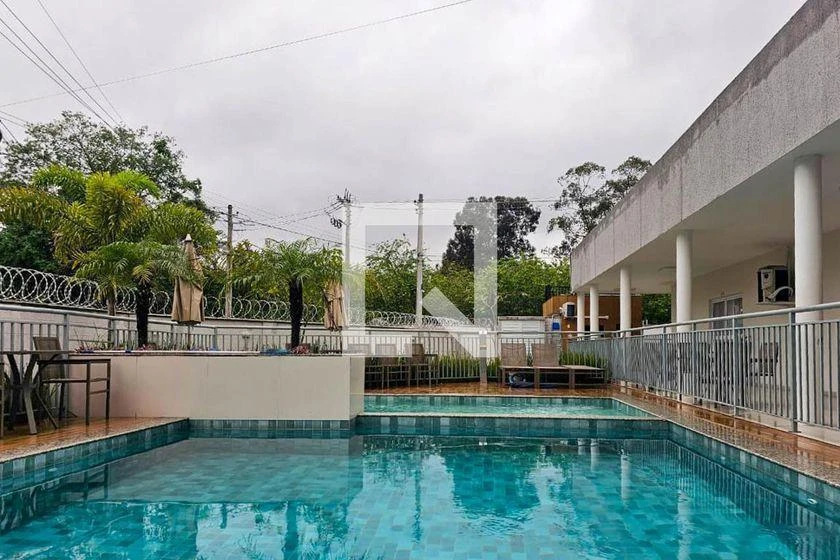 2-bedroom apartment in a building with a pool — photo 18