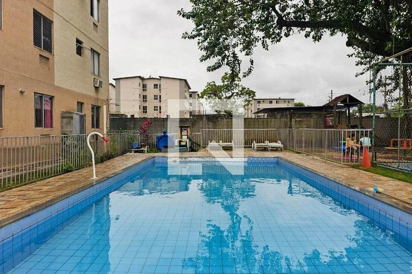 2-bedroom apartment in a building with a pool — photo 8