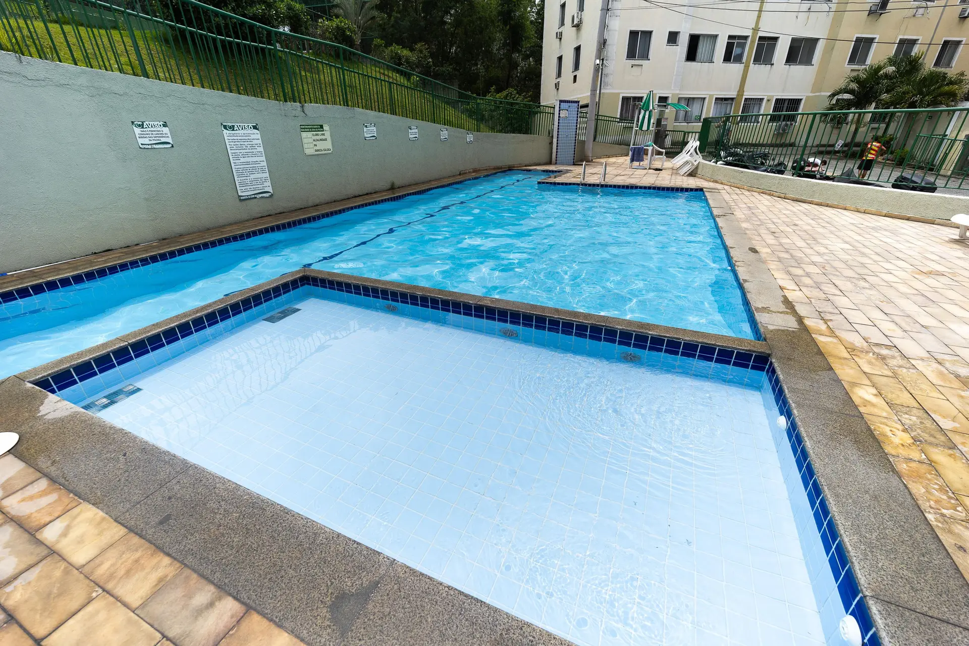 2-bedroom apartment in a building with a pool — photo 7